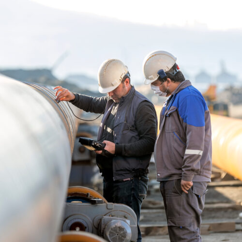 Technician collecting UT readings on pipe